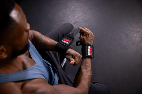 Man putting on his Versa Wrapps before a workout